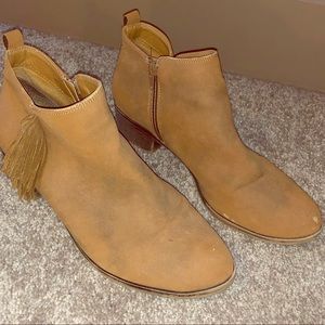 Brown sued fringe booties
